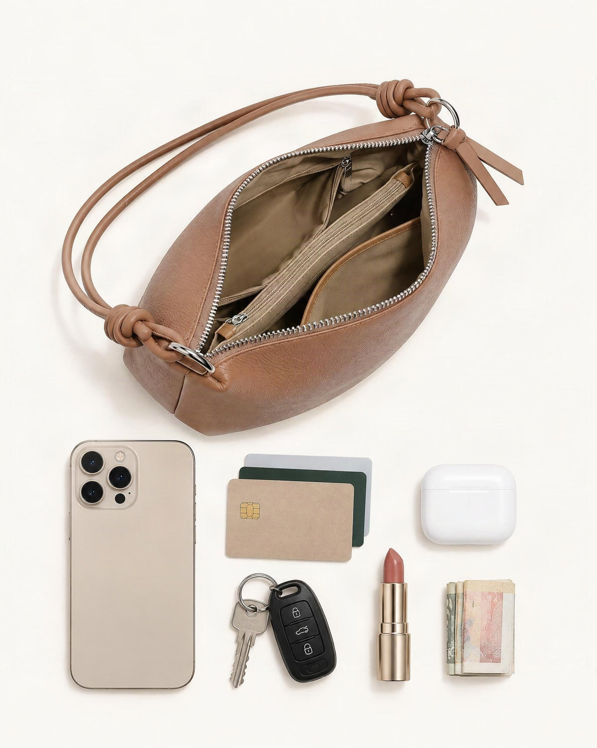 What fits in the Pebbled Cowhide Leather Tote Shoulder Bag: smartphone up to 6.9 in, cards, keys, a lipstick, airpods in their case, a few banknotes folded over into a small stack, no complete flat bill face showing