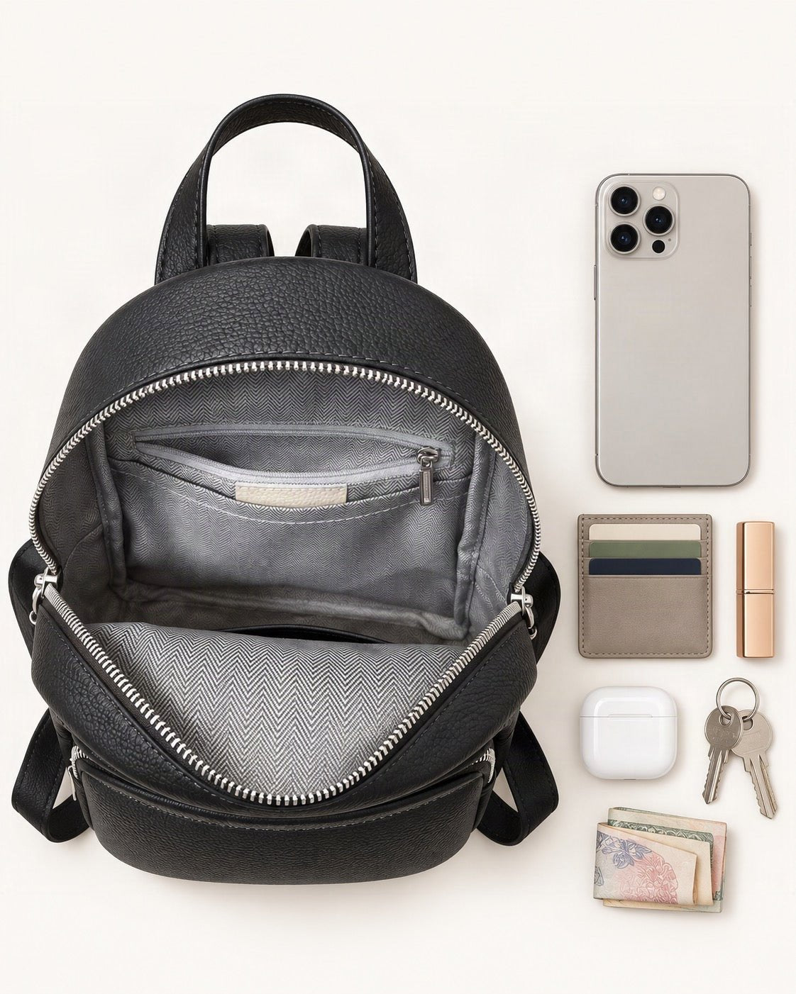 What fits in the Leather Mini Backpack: smartphone up to 6.9 in, cards, keys, a lipstick, airpods in their case, a few banknotes folded over into a small stack, no complete flat bill face showing