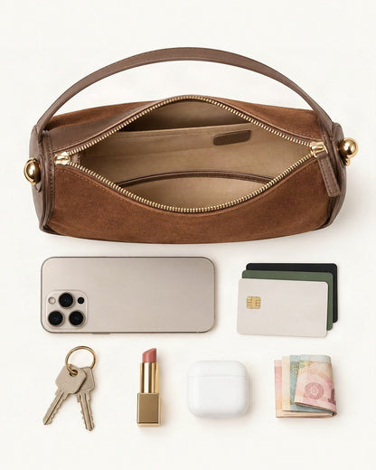 What fits in the Suede Cowhide Small Crossbody Bag: a 6.9-inch phone (iPhone 16 Pro Max), cards, keys, a lipstick, AirPods in their case, folded notes