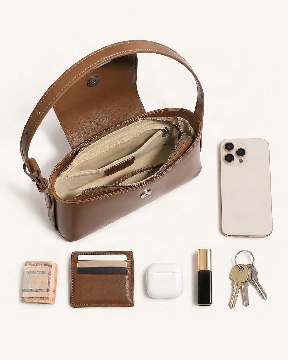 What fits in the Genuine Leather Envelope Shoulder Bag with Adjustable Strap: smartphone up to 6.9 in, cards, keys, a lipstick, airpods in their case, a few banknotes folded over into a small stack, no complete flat bill face showing