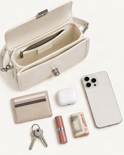 What fits in the Cowhide Leather Messenger Crossbody Bag – Color Options: smartphone up to 6.9 in, cards, keys, a lipstick, airpods in their case, a few banknotes folded over into a small stack, no complete flat bill face showing