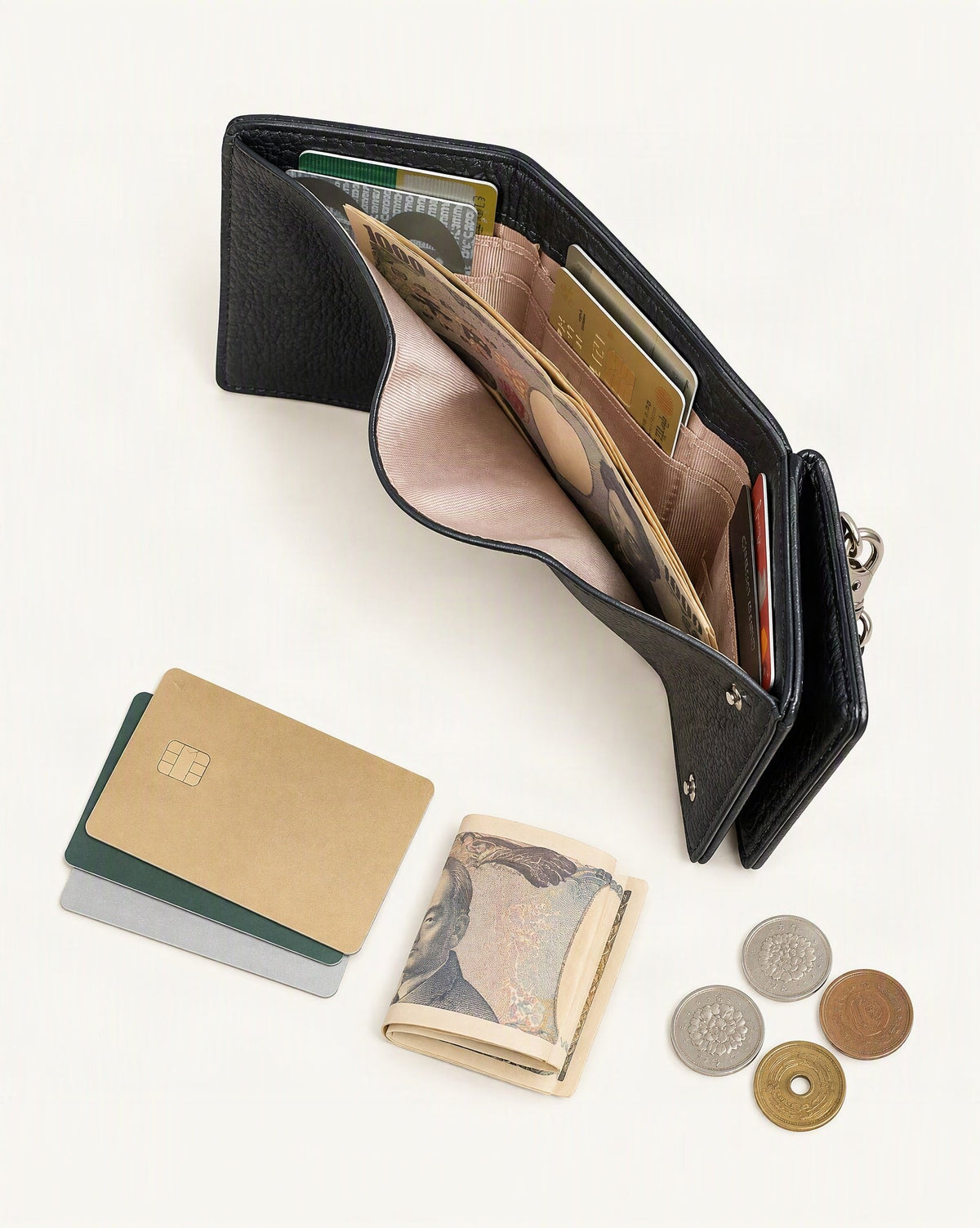 What fits in the Cowhide Leather Tri-Fold RFID-Blocking Wallet: cards, a few banknotes folded over into a small stack, no complete flat bill face showing, coins