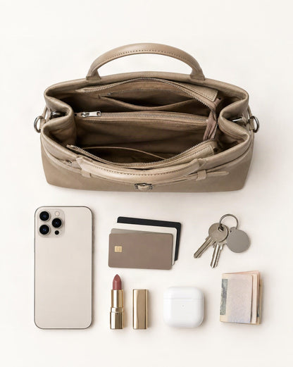 What fits in the Cowhide Leather Small Tote Bag with Adjustable Strap: smartphone up to 6.9 in, cards, keys, a lipstick, airpods in their case, a few banknotes folded over into a small stack, no complete flat bill face showing