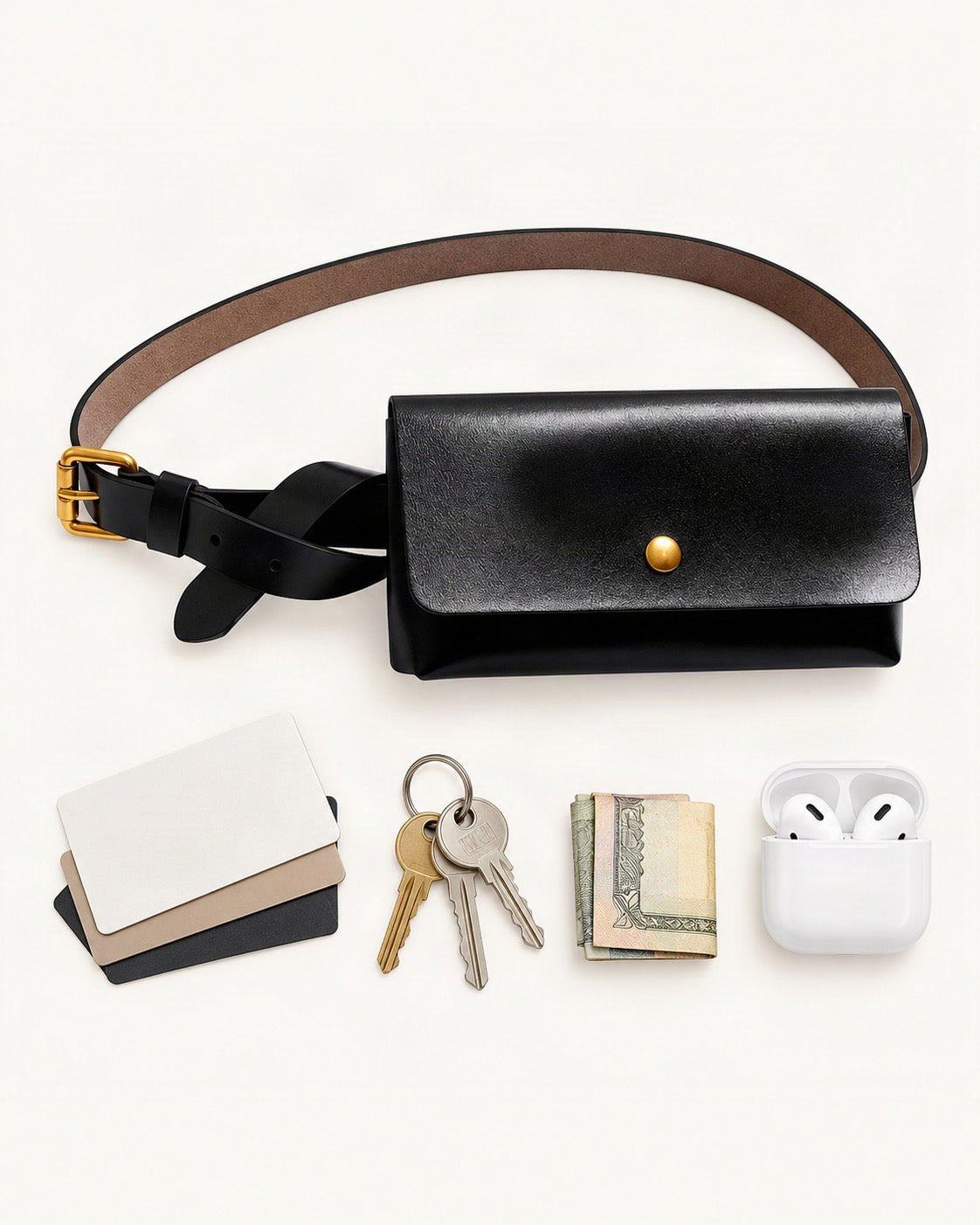 What fits in the Split Leather Belt Bag: cards, keys, a few banknotes folded over into a small stack, no complete flat bill face showing, earbuds