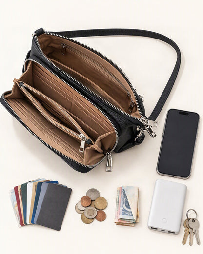 What fits in the Top Grain Leather Crossbody Bag with 10 Card Slots: smartphone up to 6.9 in, a slim power bank, up to 10 cards, coins, a few banknotes folded over into a small stack, no complete flat bill face showing, keys