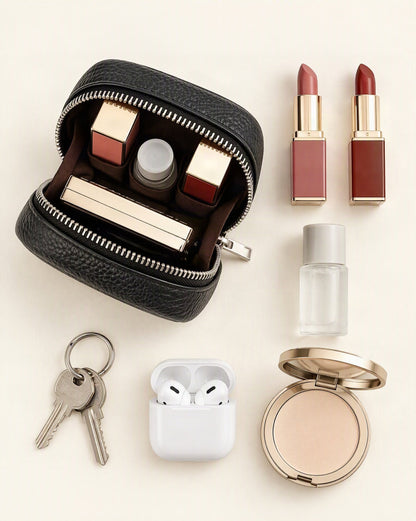 What fits in the Pebbled Leather Mini Cosmetic Pouch: lipsticks, a small skincare bottle, a compact powder, airpods in their case, keys