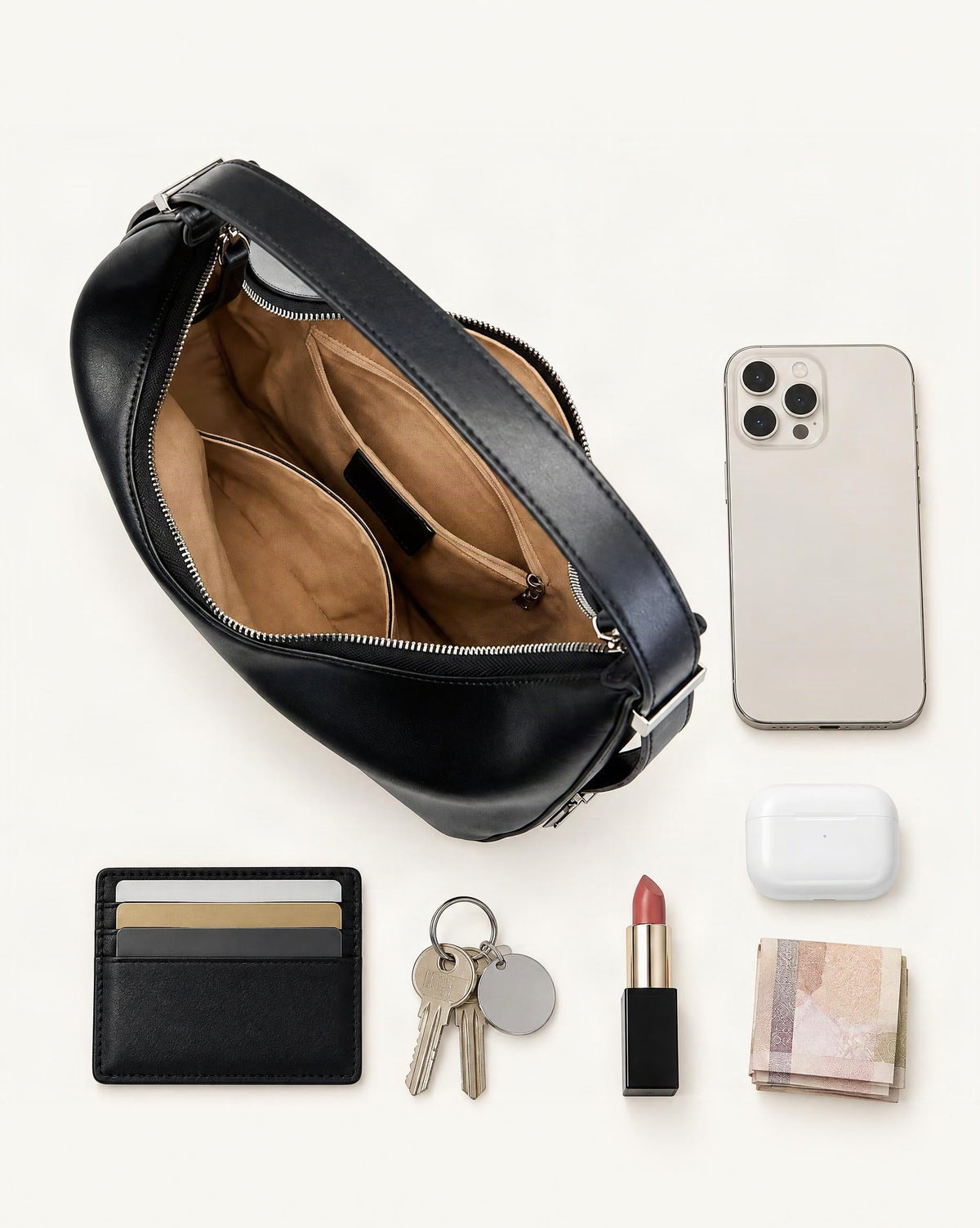 What fits in the Cowhide Leather Crescent Hobo Shoulder Bag – Color Options: smartphone up to 6.9 in, cards, keys, a lipstick, airpods in their case, a few banknotes folded over into a small stack, no complete flat bill face showing