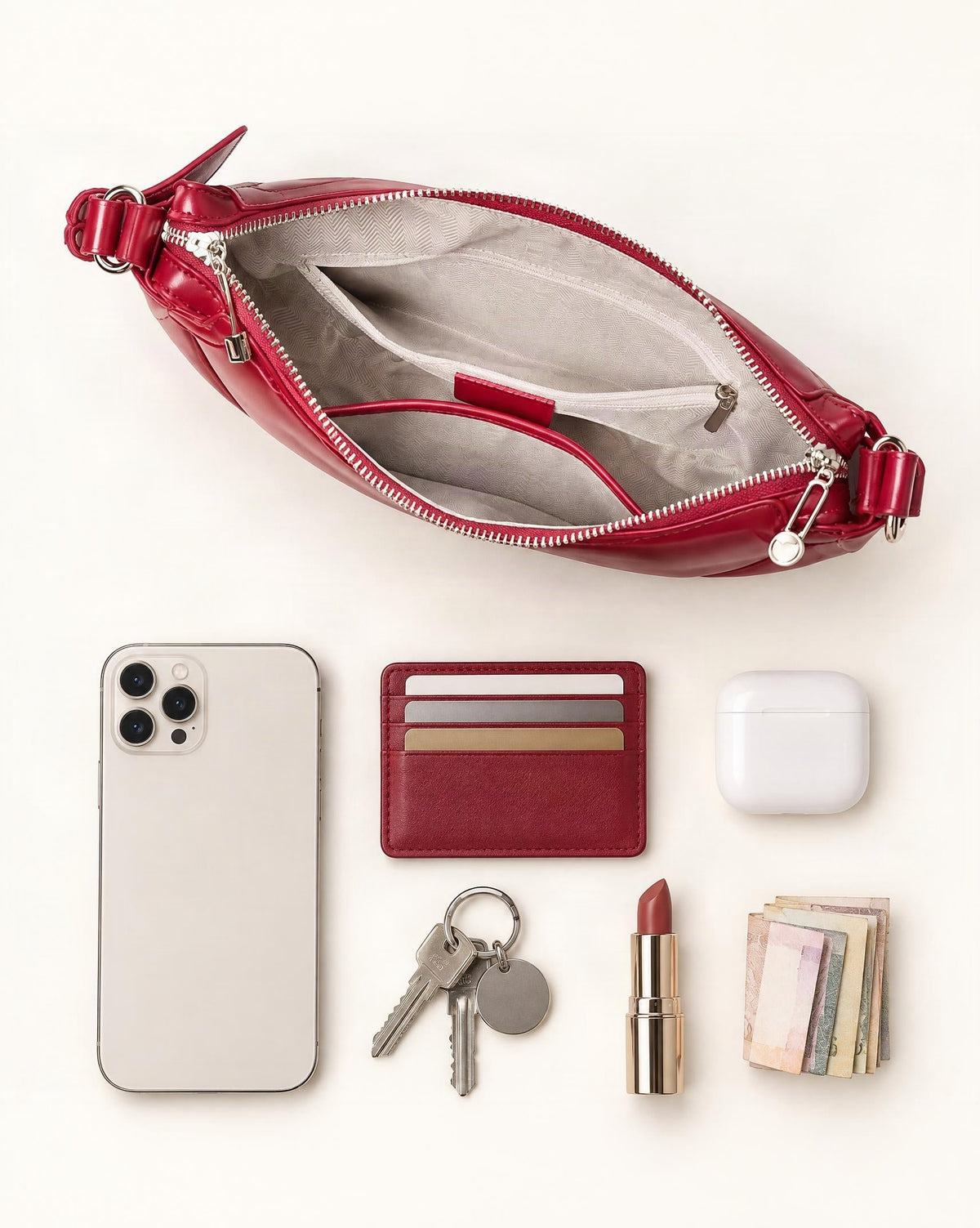 What fits in the Cowhide Leather Crescent Shoulder Bag: smartphone up to 6.9 in, cards, keys, a lipstick, airpods in their case, a few banknotes folded over into a small stack, no complete flat bill face showing