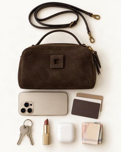 What fits in the Nubuck Cowhide Small Crossbody Bag – Color Options: a 6.9-inch phone (iPhone 16 Pro Max), cards, keys, a lipstick, AirPods in their case, folded notes