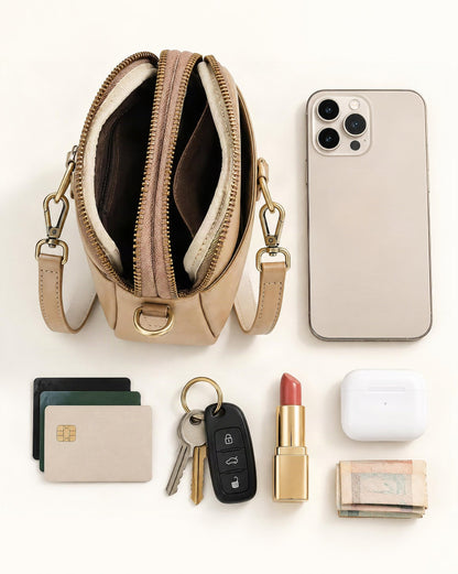What fits in the Cowhide Leather Micro Crossbody Bag with Adjustable Strap: smartphone up to 6.9 in, cards, keys, a lipstick, airpods in their case, a few banknotes folded over into a small stack, no complete flat bill face showing