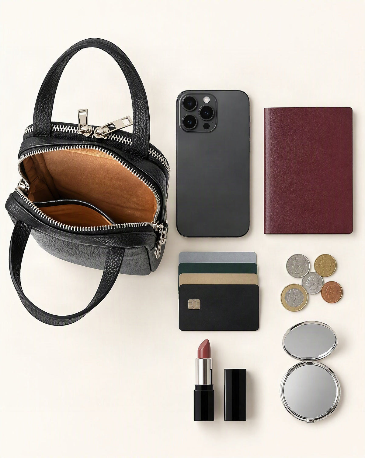 What fits in the Cowhide Leather Vertical Phone Crossbody Bag – Color Options: smartphone up to 6.9 in, a passport, cards, coins, a lipstick, a compact mirror