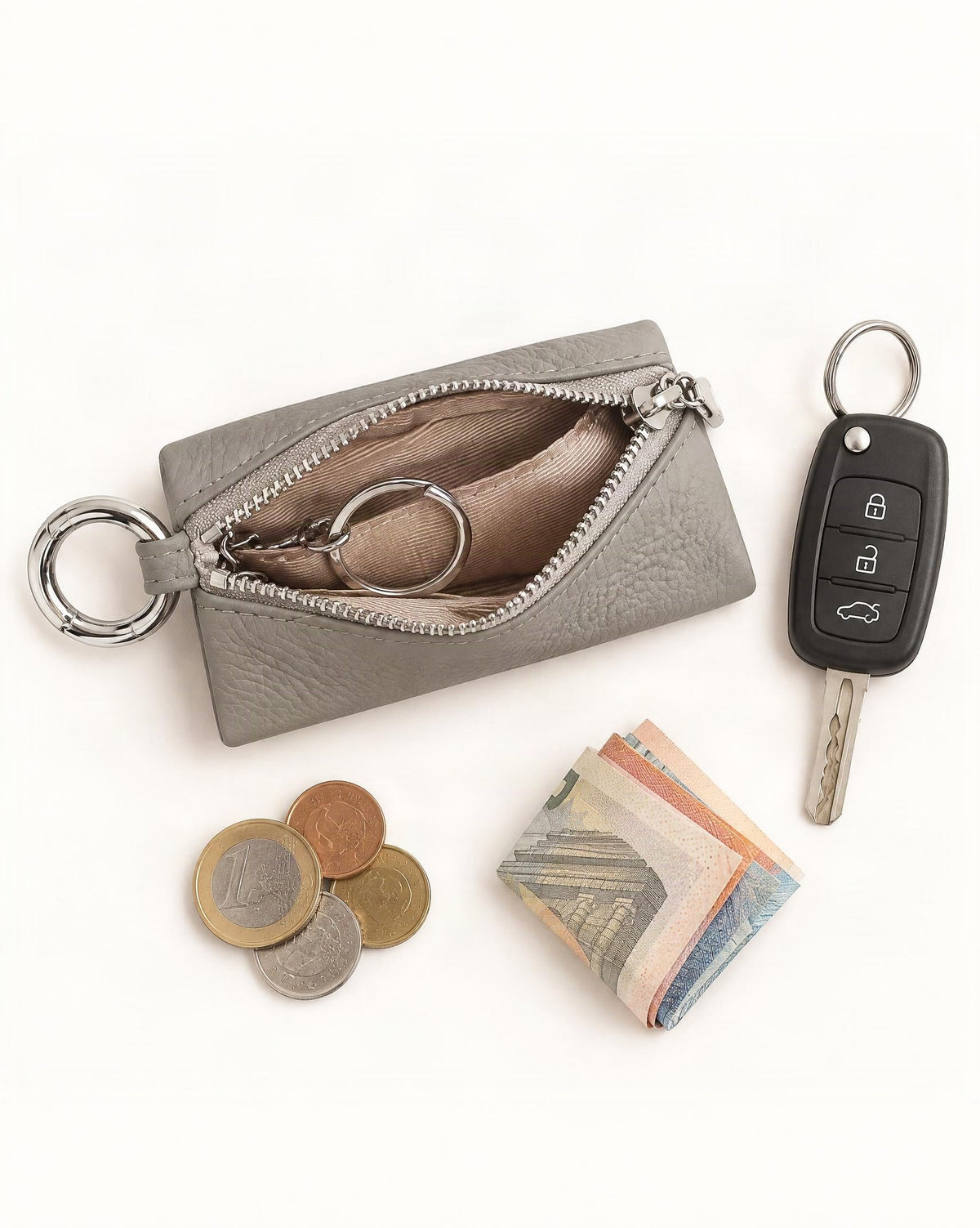 What fits in the Cowhide Leather Key Chain Coin Pouch: keys or a car key, coins, a few banknotes folded over into a small stack, no complete flat bill face showing