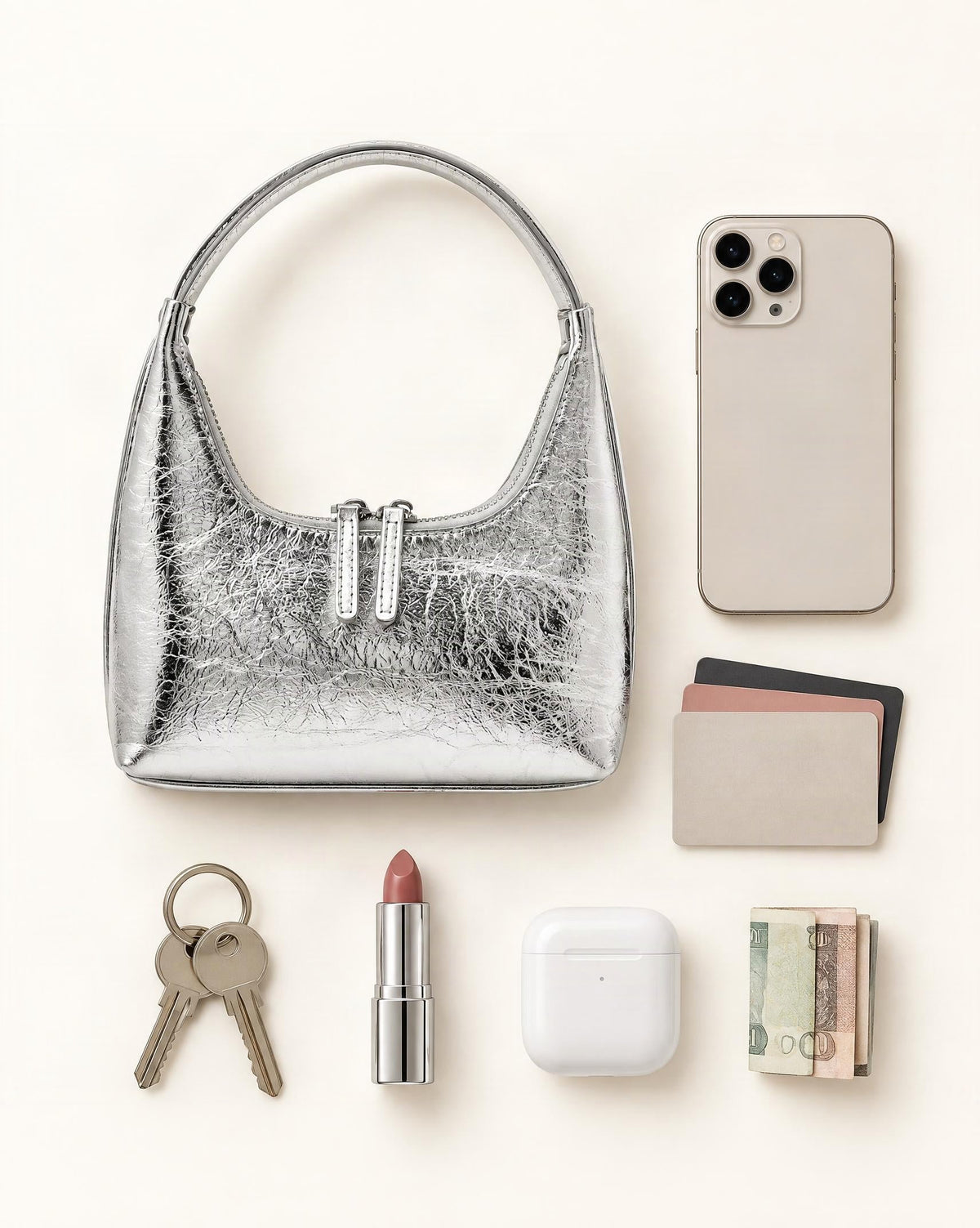 What fits in the Cowhide Mini Top-Handle Hobo Bag with Double Zipper: smartphone up to 6.3 in, cards, keys, a lipstick, airpods in their case, a few banknotes folded over into a small stack, no complete flat bill face showing