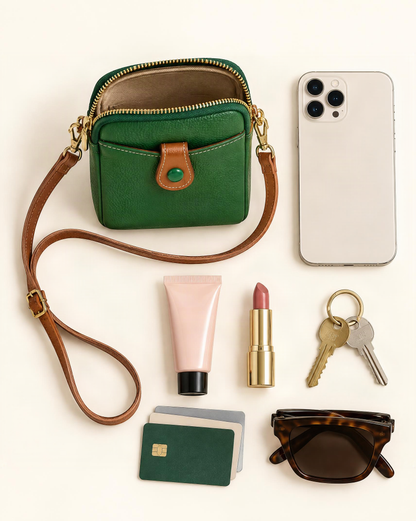 What fits in the Cowhide Micro Crossbody Phone Bag with Detachable Strap: smartphone up to 6.9 in, a compact perfume or hand cream, a lipstick, keys, cards, folding sunglasses