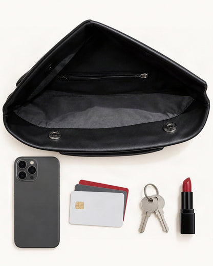 What fits in the Cowhide Envelope Clutch Bag: smartphone up to 6.9 in, cards, keys, lipstick