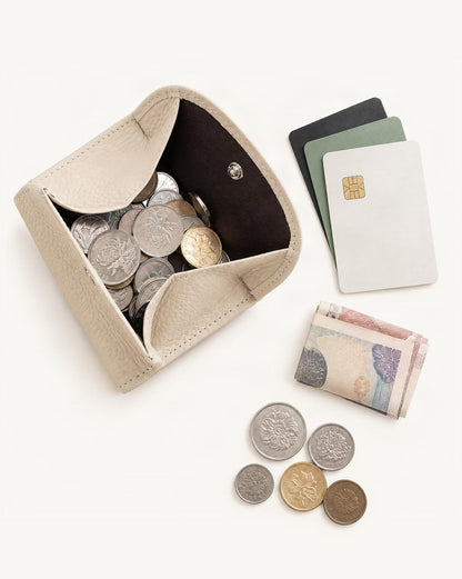 What fits in the Genuine Leather Bifold Wallet with 8 Card Slots: cards, a few banknotes folded over into a small stack, no complete flat bill face showing, coins