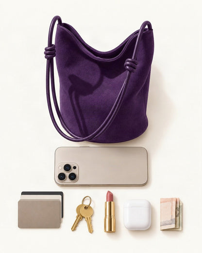 What fits in the Nubuck Cowhide Mini Bucket Shoulder Bag: a 6.9-inch phone (iPhone 16 Pro Max), cards, keys, a lipstick, AirPods in their case, folded notes