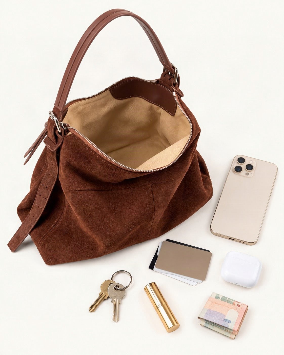 What fits in the Suede Cowhide Small Plus Shoulder Tote Bag: a 6.9-inch phone (iPhone 16 Pro Max), cards, keys, a lipstick, AirPods in their case, folded notes