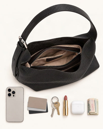 What fits in the Pebbled Cowhide Small Plus Shoulder Hobo Bag: smartphone up to 6.9 in, cards, keys, a lipstick, airpods in their case, a few banknotes folded over into a small stack, no complete flat bill face showing