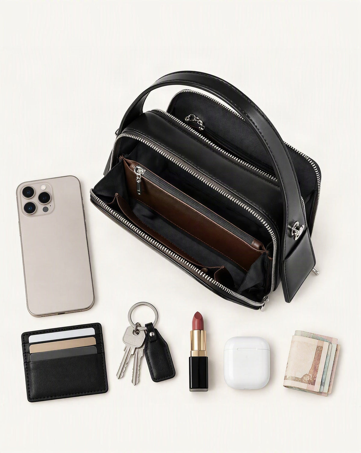 What fits in the Cowhide Leather Small Crossbody Bag – Color Options: smartphone up to 6.9 in, cards, keys, a lipstick, airpods in their case, a few banknotes folded over into a small stack, no complete flat bill face showing