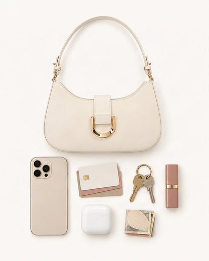 What fits in the Fitted Small Cowhide Leather Shoulder Bag with Buckle: smartphone up to 6.9 in, cards, keys, a lipstick, airpods in their case, a few banknotes folded over into a small stack, no complete flat bill face showing